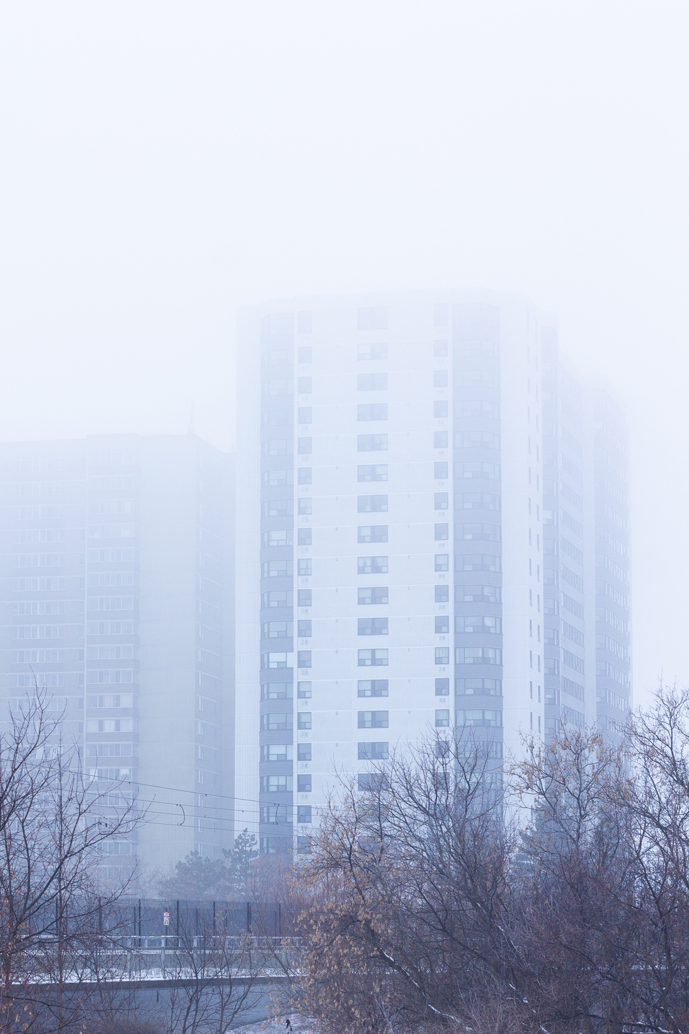 Misty day, tops of buildings covered in fog